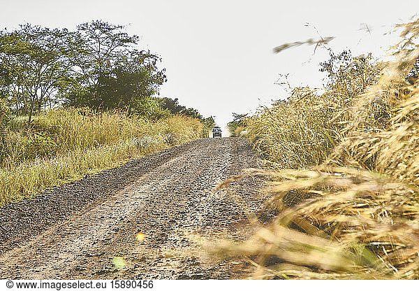 Ethiopia  Car driving along African dirt road