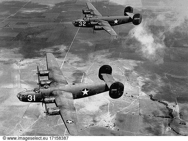 EUROPE -- 1940s -- Two US Air Force B-24 'Liberator' long-range bombers flying on a mission over Europe during World War 2 -- Picture by Lightroom Photos / USAF.
