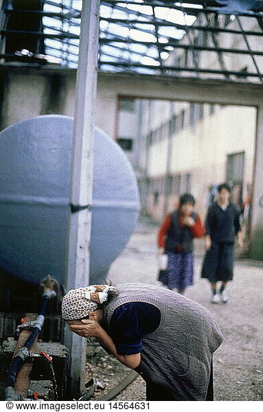 events  Bosnian War 1992 - 1995  refugees in villages around Sarajewo in Posusje  Bosnia  woman washing herself  15.12.1992  Yugoslavia  Yugoslav Wars  Balkans  conflict  people  misery  1990s  90s  20th century  historic  historical  Bosnia-Herzegovina  Bosnia - Herzegovina  women  female