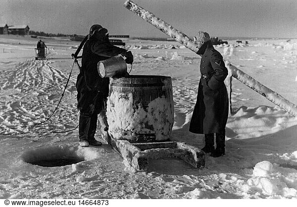 events  Second World War / WWII  Finland  German soldiers getting water from a frozen lake  probably winter 1941/1942  20th century  historic  historical  soldier  soldiers  Wehrmacht  Continuation War 1941 - 1944  Germany  coat  snow  cask  bucket  sledge  Shopkosero  Shapkosero  Shopkocero  Shapkocero  supply  cold  coldness  people  1940s