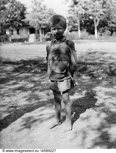 events  Second World War / WWII  Russia 1942 / 1943  a Russian child behind the front  circa 1942  people  children  boy  kid  kids  rear area  misery  distress  poverty  pauperism  bedraggled  tattered clothes  20th century  historic  historical  dirty  1940s