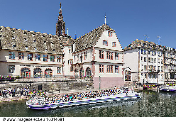 Excursion boat on River Ill  Historical Museum and Cathedral  Strasbourg  Alsace  France  Europe