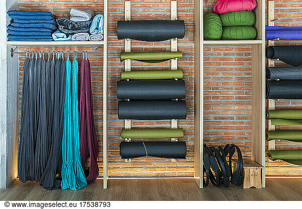 Exercise equipment arranged in rack at yoga studio