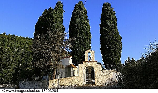 Exogi village  cemetery  gate  cypress trees  blue cloudless sky  Ithaca Island  Ionian Islands  Greece  Europe