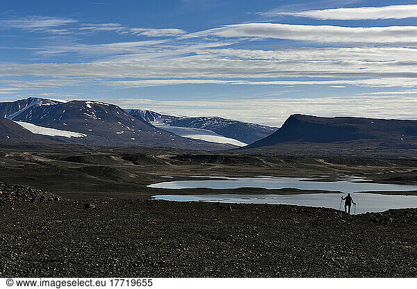 Expedition team member admires the vastness of the mighty Vandredalen and the distant glaciers spilling out into the landscape.