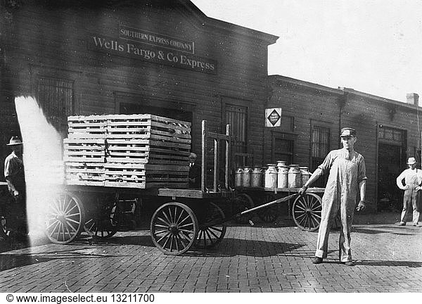 Expressmen in front of a Wells Fargo & Co Express depot