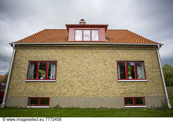 Exterior of house against cloudy sky
