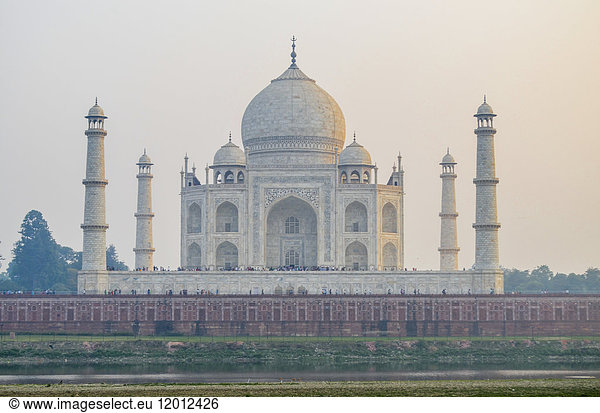 Exterior view of the Taj Mahal palace and mausoleum  with decorated exterior inlaid marble walls dome and towers. A UNESCO world heritage site