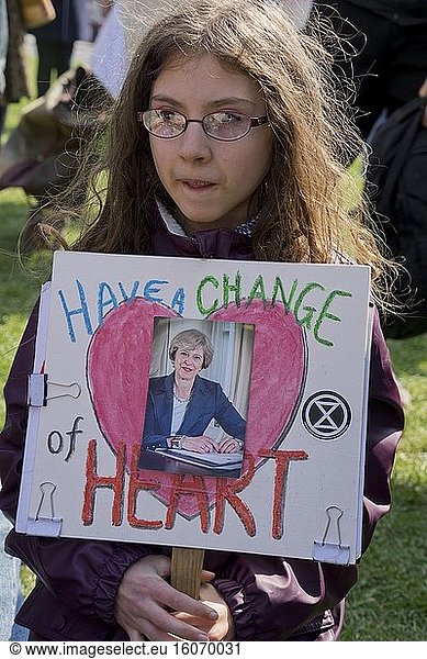 Extinction Rebellion young girl activist in rally in Parliament Square to demand action from government against climate change. London England UK.