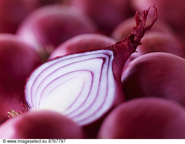 Extreme close up of raw sliced red onion