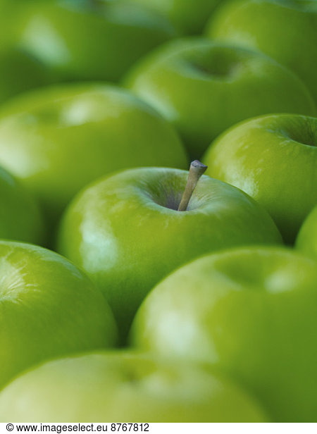 Extreme close up of whole green Granny Smith apples