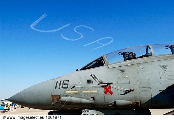 F-14 aircraft nose with USA in skywriting in background