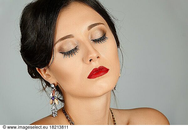 Face of beautiful young woman with brown eyes and red lips. Beauty portrait  fresh skin. Natural makeup