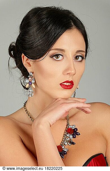 Face of beautiful young woman with brown eyes and red lips. Beauty portrait  fresh skin. Natural makeup
