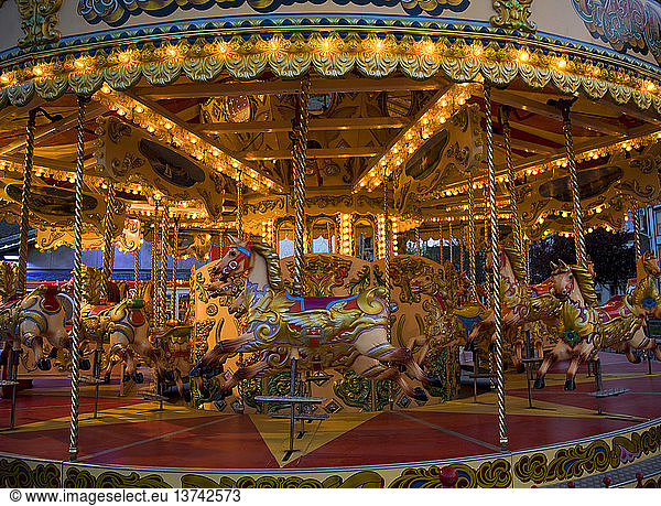 Fairground carousel ride with horses and no people  Weymouth  Dorset  England