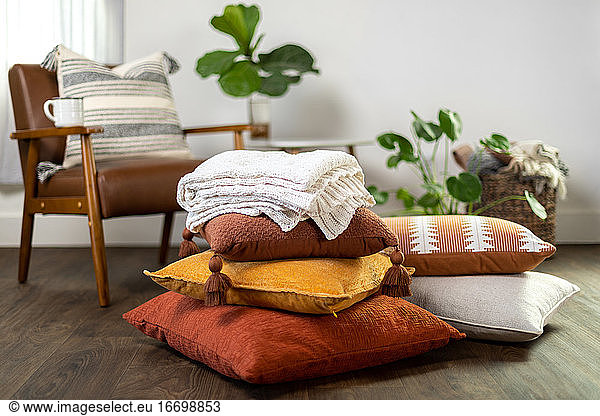 Fall Pillows and Blanket Stacked Up