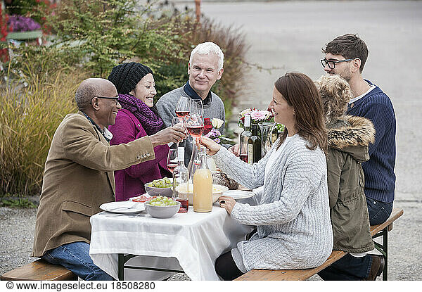 Family and friends enjoying outdoor party at farmhouse  Bavaria  Germany