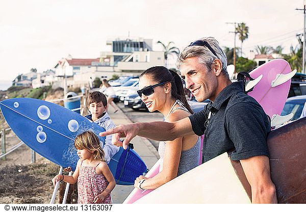 Family at coast with surfboards  Encinitas  California  USA