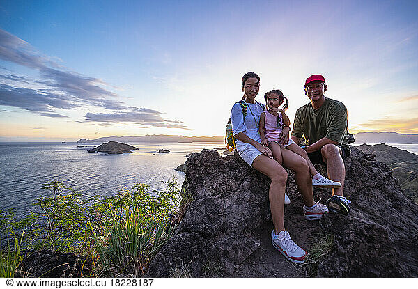 family at viewpoint above east Nusa Tenggara island in Komodo