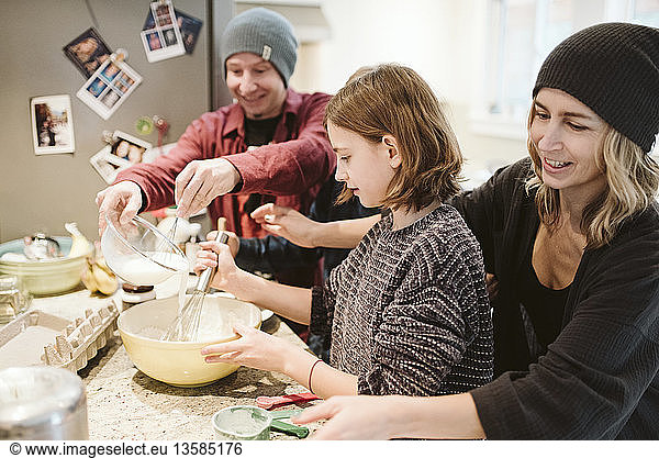 Family baking in kitchen