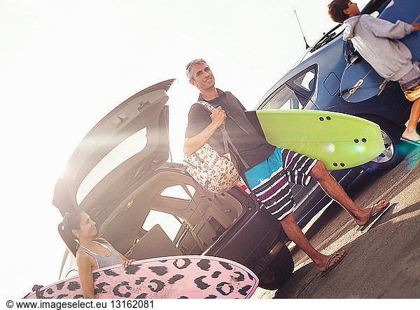 Family carrying surfboards  Encinitas  California  USA