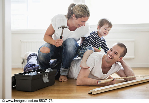 Family having fun while renovating their home