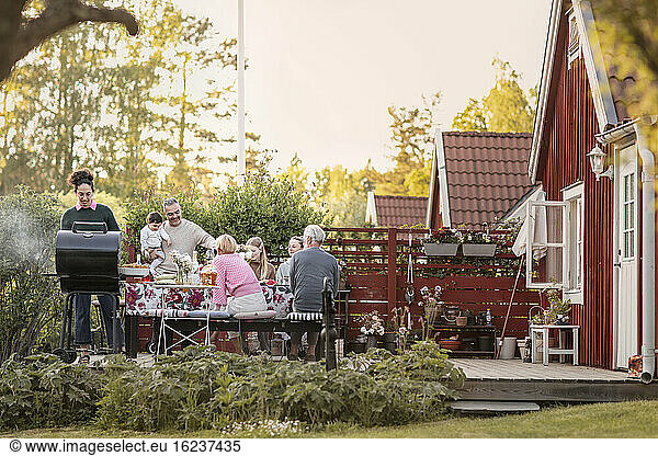Family having meal in garden