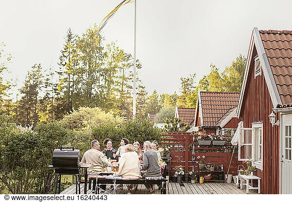 Family having meal in garden
