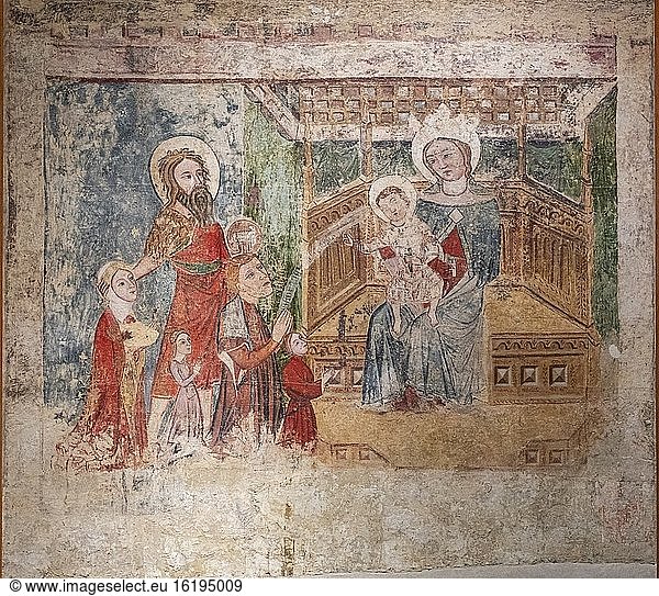 Family of donors presented by Saint John the Baptist  Ipas mural paintings  XV century  fresco torn off and transferred to canvas  come from the hermitage of Our Lady of Ipas  Diocesan Museum of Jaca  Huesca  Spain.