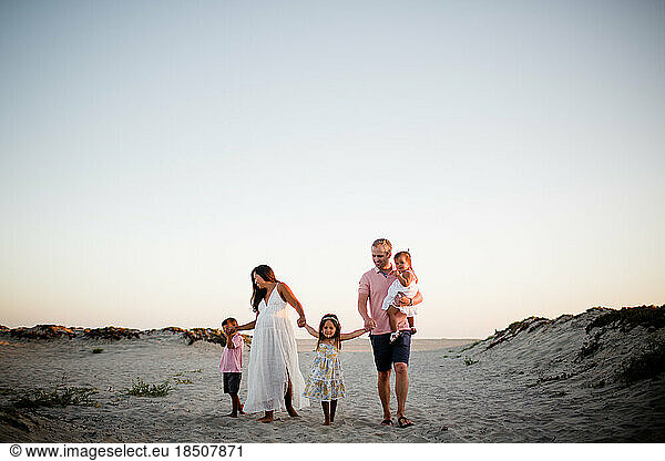 Family of Five Holding Hands & Walking on Coronado Beach in San Diego