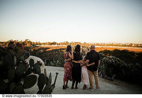 Family of Four Enjoying the View in Garden in San Diego