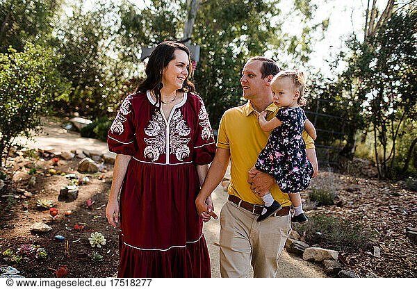 Family of Three Walking Through Garden in California