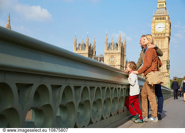 Family on westminster bridge looking at view