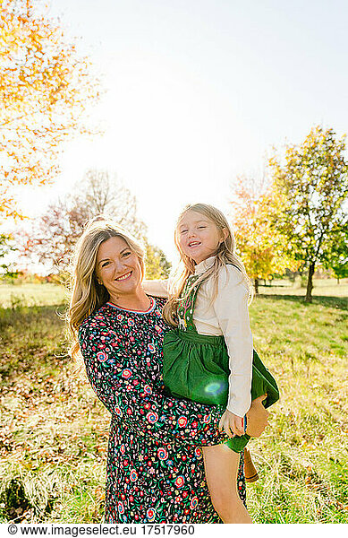 Family portrait of a mother and daughter in a local park