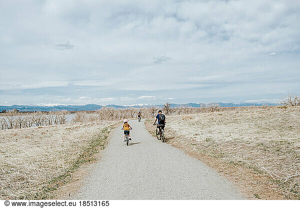 family riding bikes on a sunny day