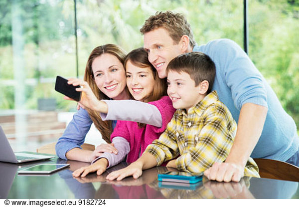 Family taking cell phone picture together