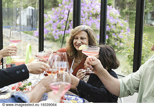 Family toasting while enjoying dinner party