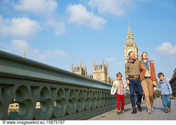 Family walking across westminster bridge