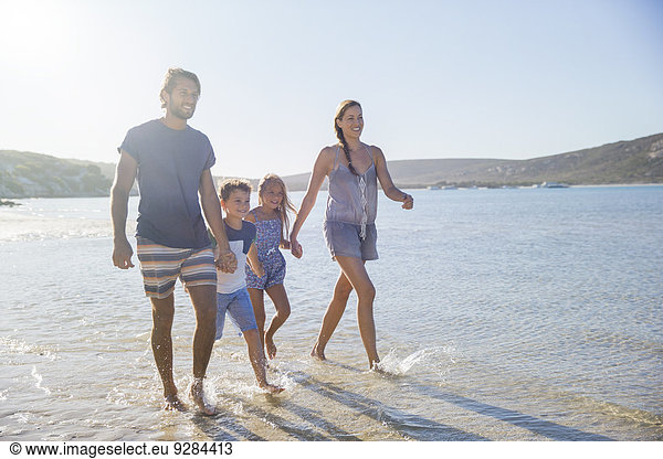 Family walking together along shore