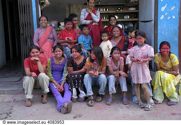 Family with colour on each others forhead for Holi festival Pokhara Nepal