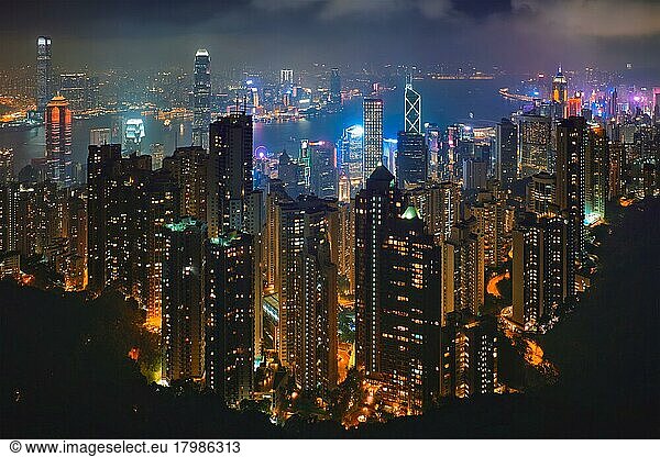 Famous view of Hong Kong  Hong Kong skyscrapers skyline cityscape view from Victoria Peak illuminated in the evening blue hour. Hong Kong  China  Asia