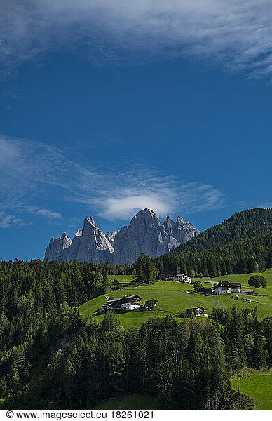 farm house on green fields in the majestic Dolomites