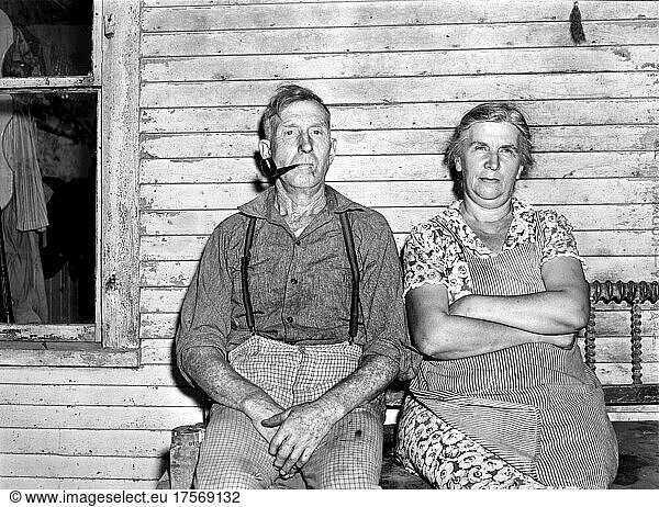 Farmer and his Wife  half-length Portrait sitting on Porch  Chittenden County  Vermont  USA  Jack Delano  U.S. Farm Security Administration  U.S. Office of War Information Photograph Collection  August 1941