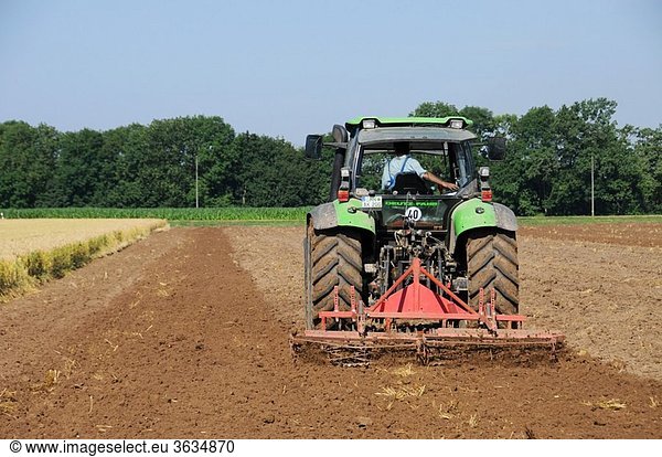 Farmer in Bavaria harrowed his land with a Deutz tractor