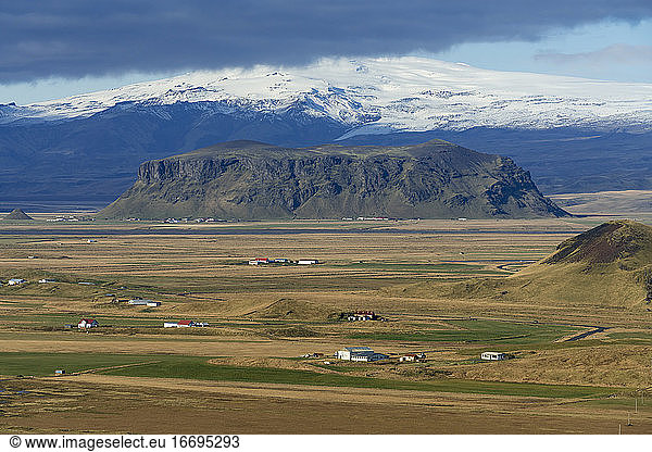 Farmhouses with mountains in background  South Iceland