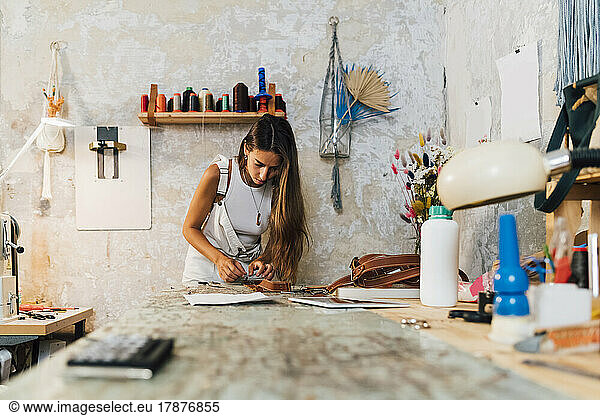 Fashion designer working at workshop