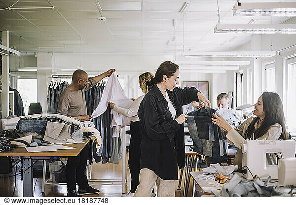 Fashion designers working together at workshop