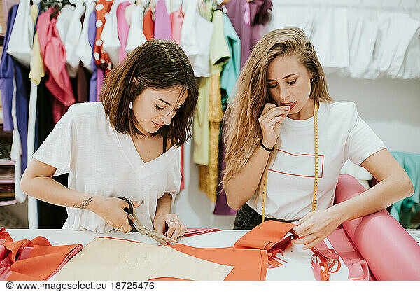 Fashion designers working together in the design studio