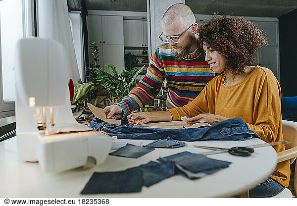 Fashion designers working together in workshop