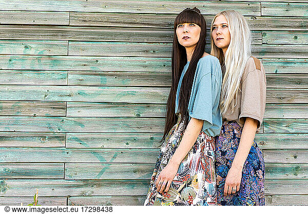 fashion girls twins posing in the street